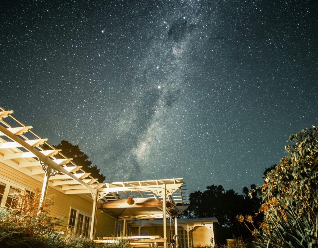 Stunning night landscape of a rural house under the Milky Way in Kerikeri, New Zealand.