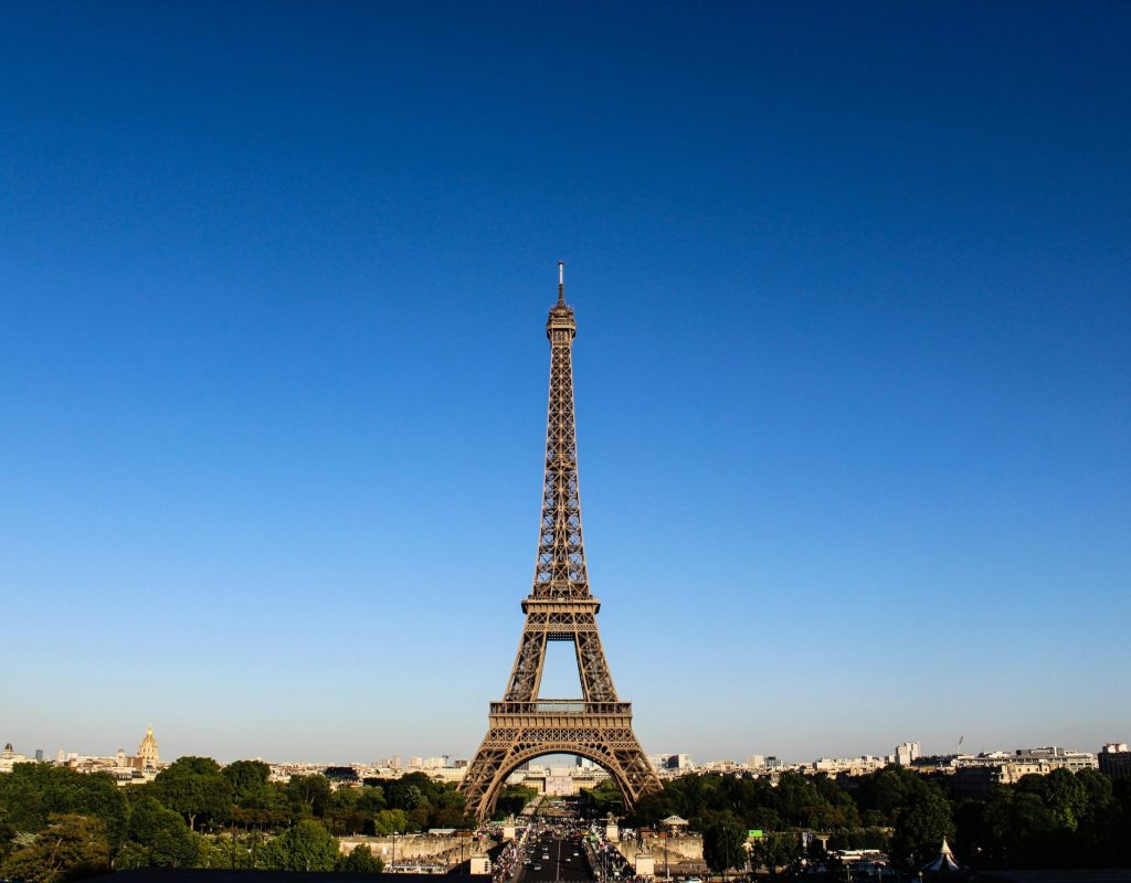 Stunning daylight shot capturing the Eiffel Tower with clear blue skies in Paris.