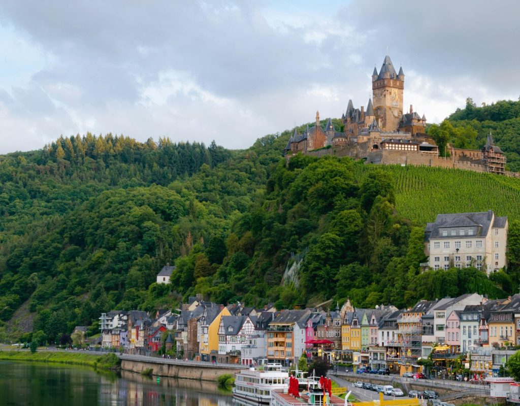 Idyllic landscape of Cochem Castle overlooking Moselle River in Germany.